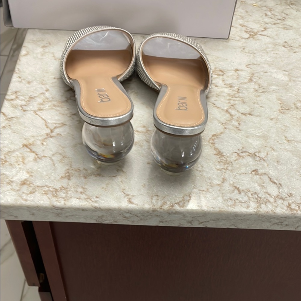 Silver sandals beautiful ball as heel .ill include back ankle straps.